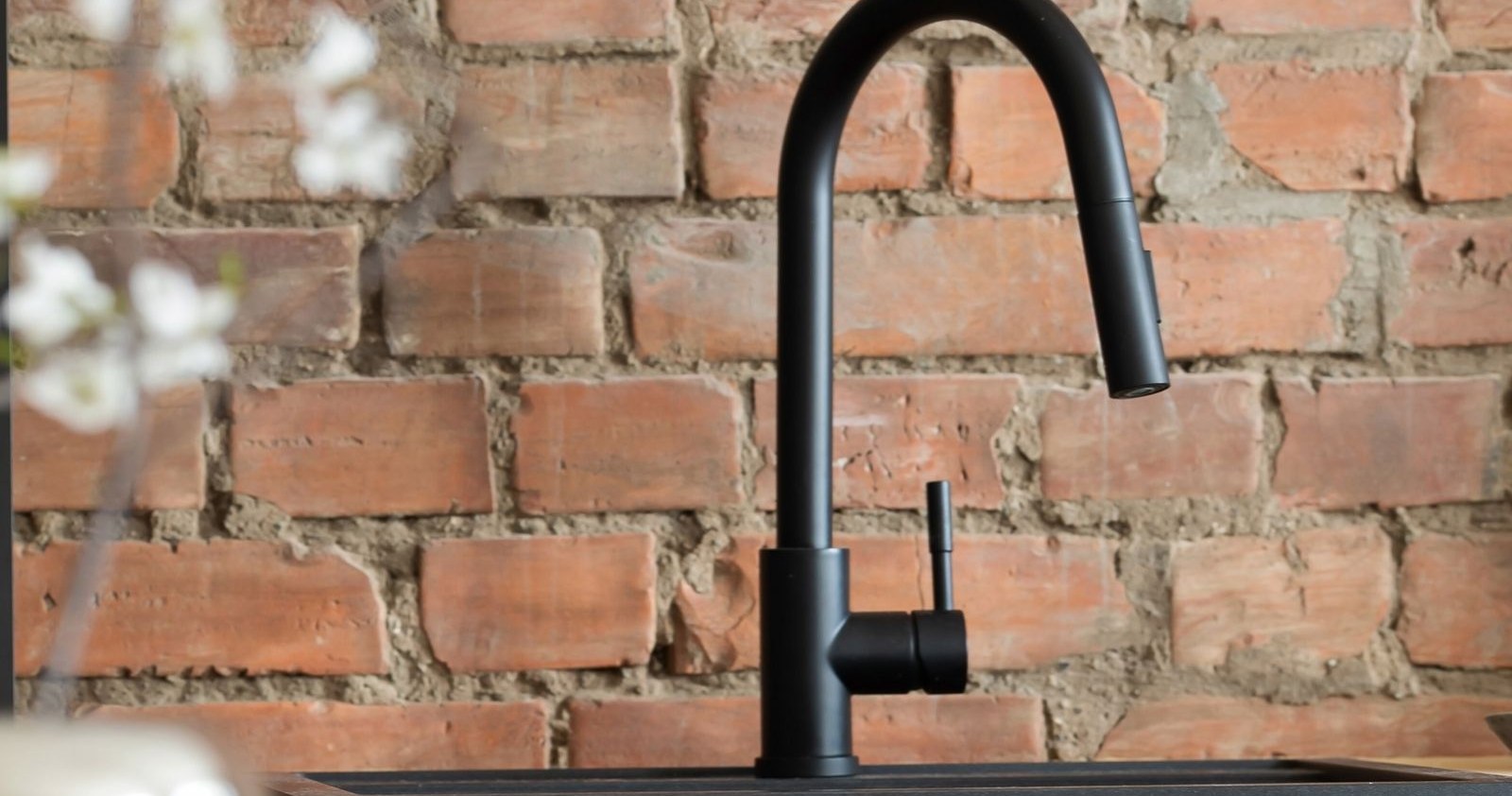 Modern black kitchen faucet at a sink